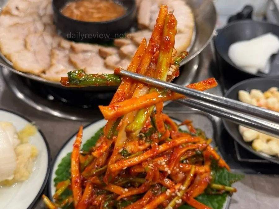 Tangy-spicy squid salad topped with sesame seeds