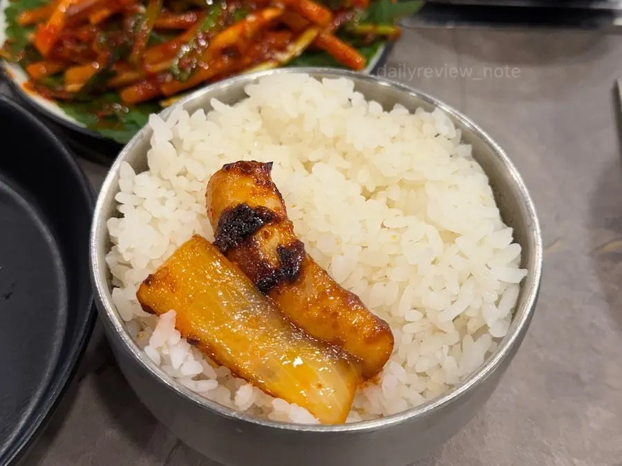 Stir-fried squid eaten with a bowl of rice