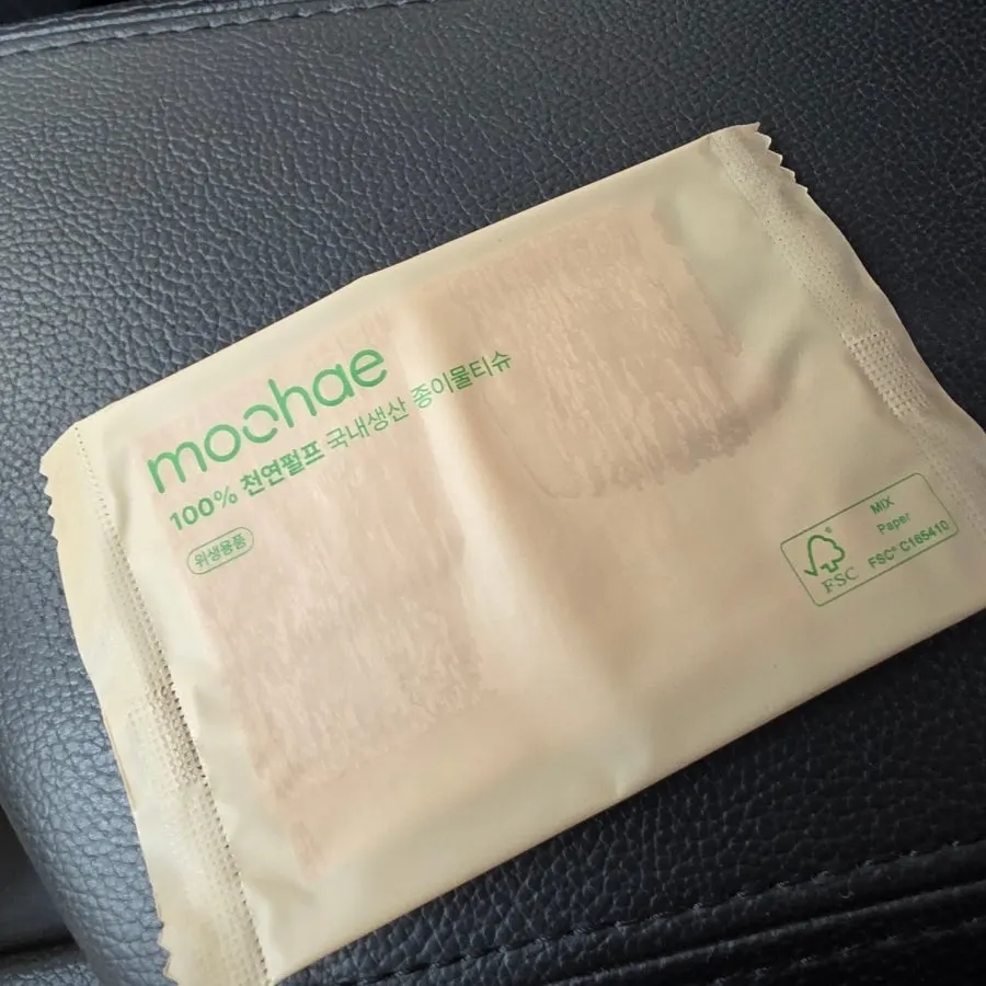Low & Sweet Bakery takeout bag with a paper wet wipe