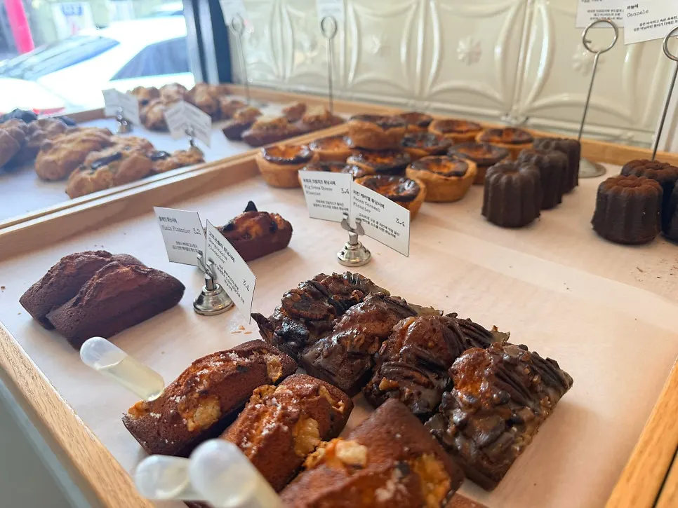 Various breads arranged on the display shelf