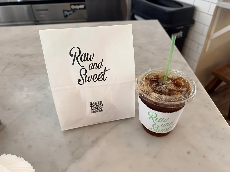 Takeout coffee and packaged dessert bags