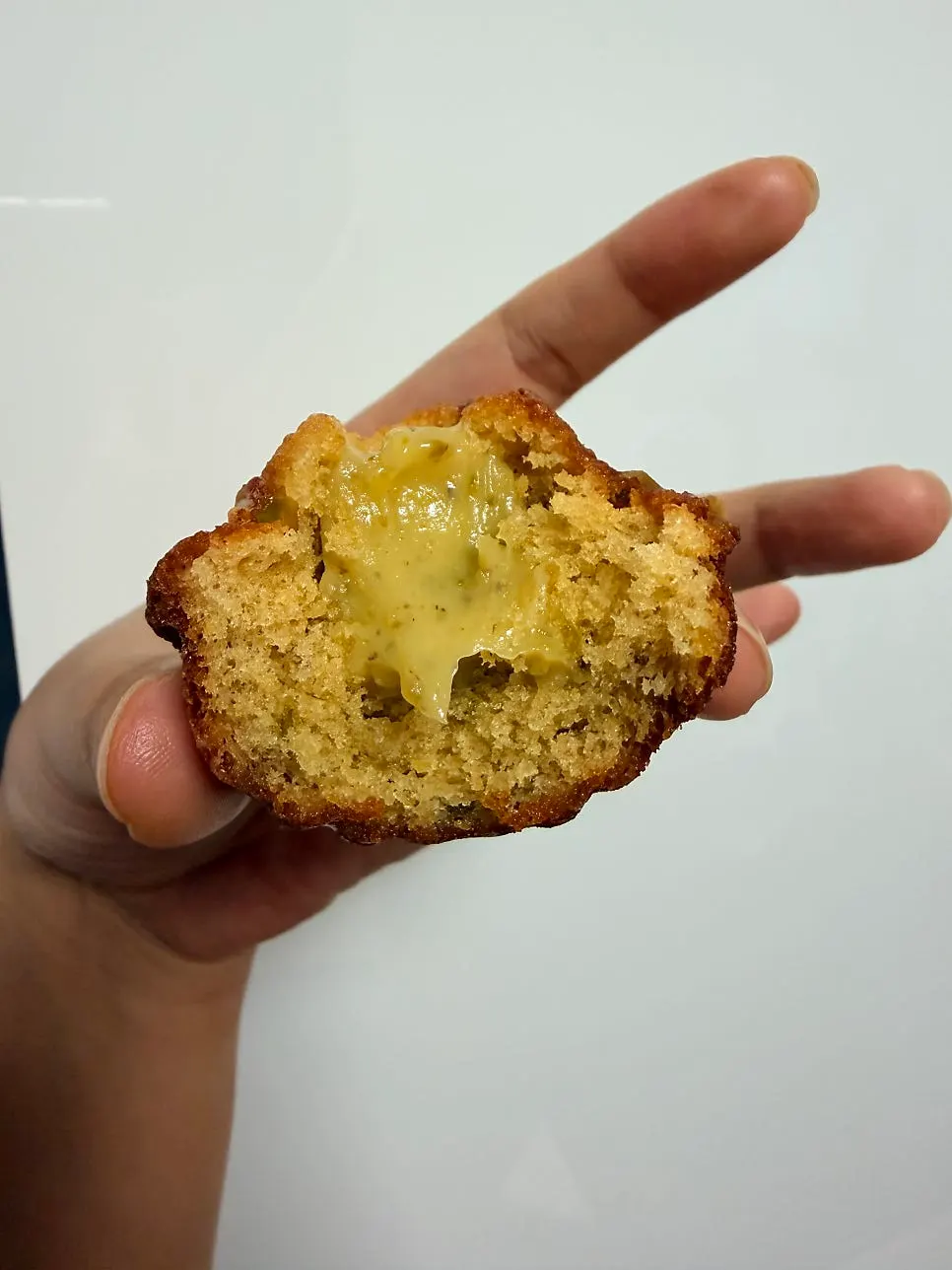 Cross-section of a dessert with cream oozing out