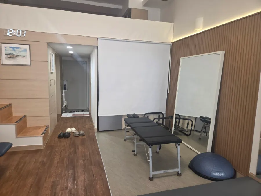 Space with stretching mats and balance exercise equipment
