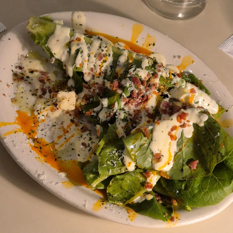 Grilled romaine topped with bacon chips