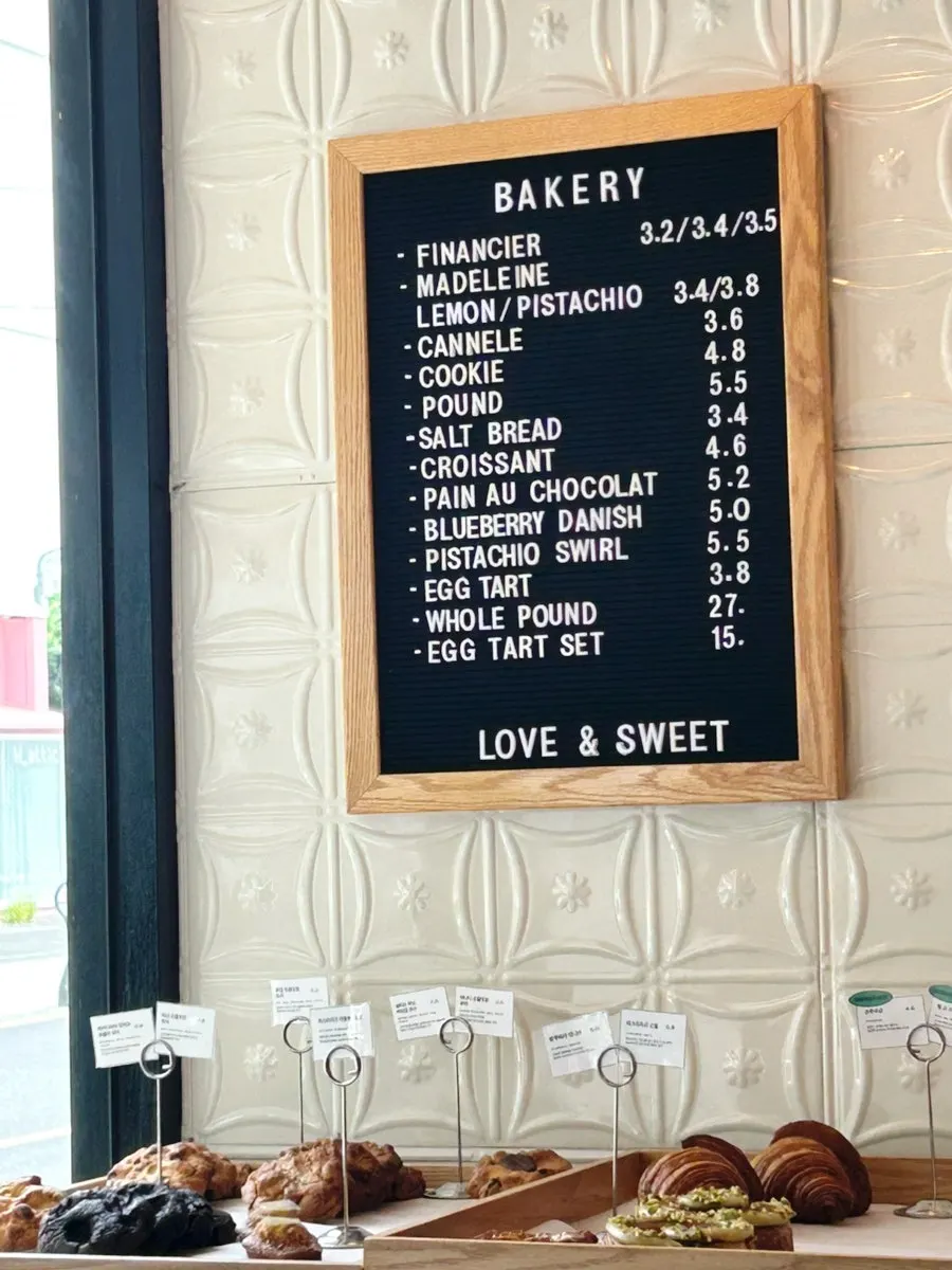 Bakery menu board with prices listed