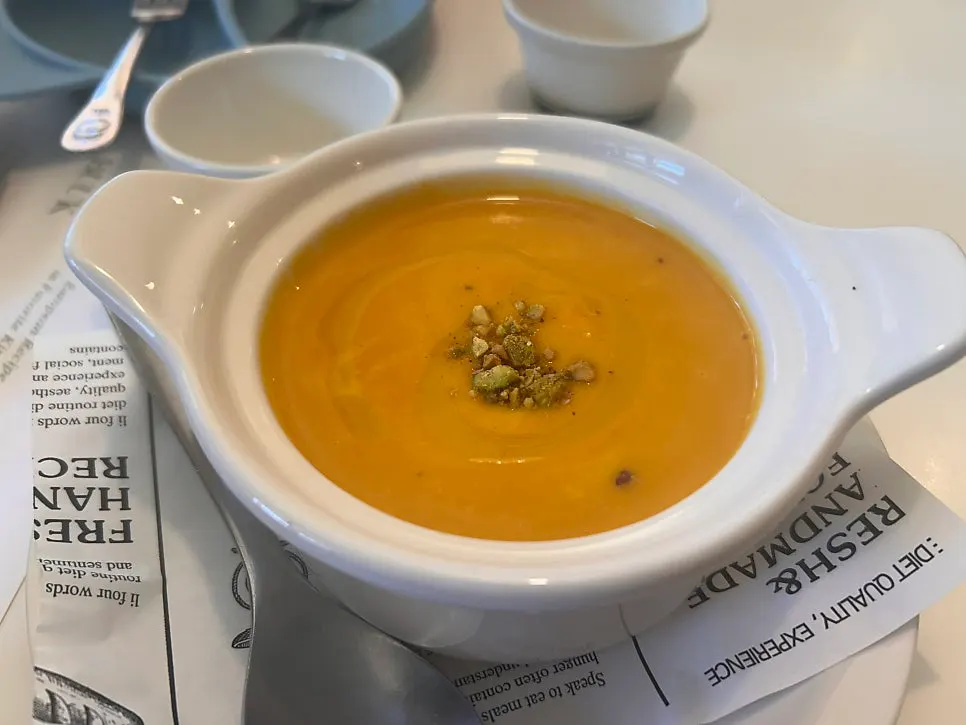 Start of the meal with pumpkin soup