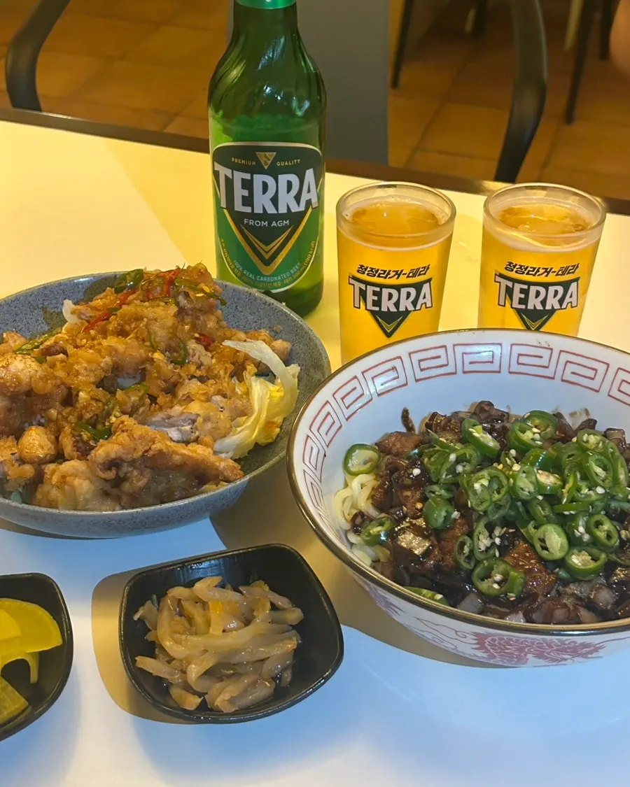 Table set with Chinese dishes and beer