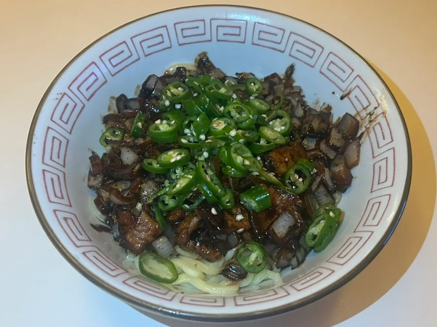 Spicy gochu ganjjajang topped with chili peppers