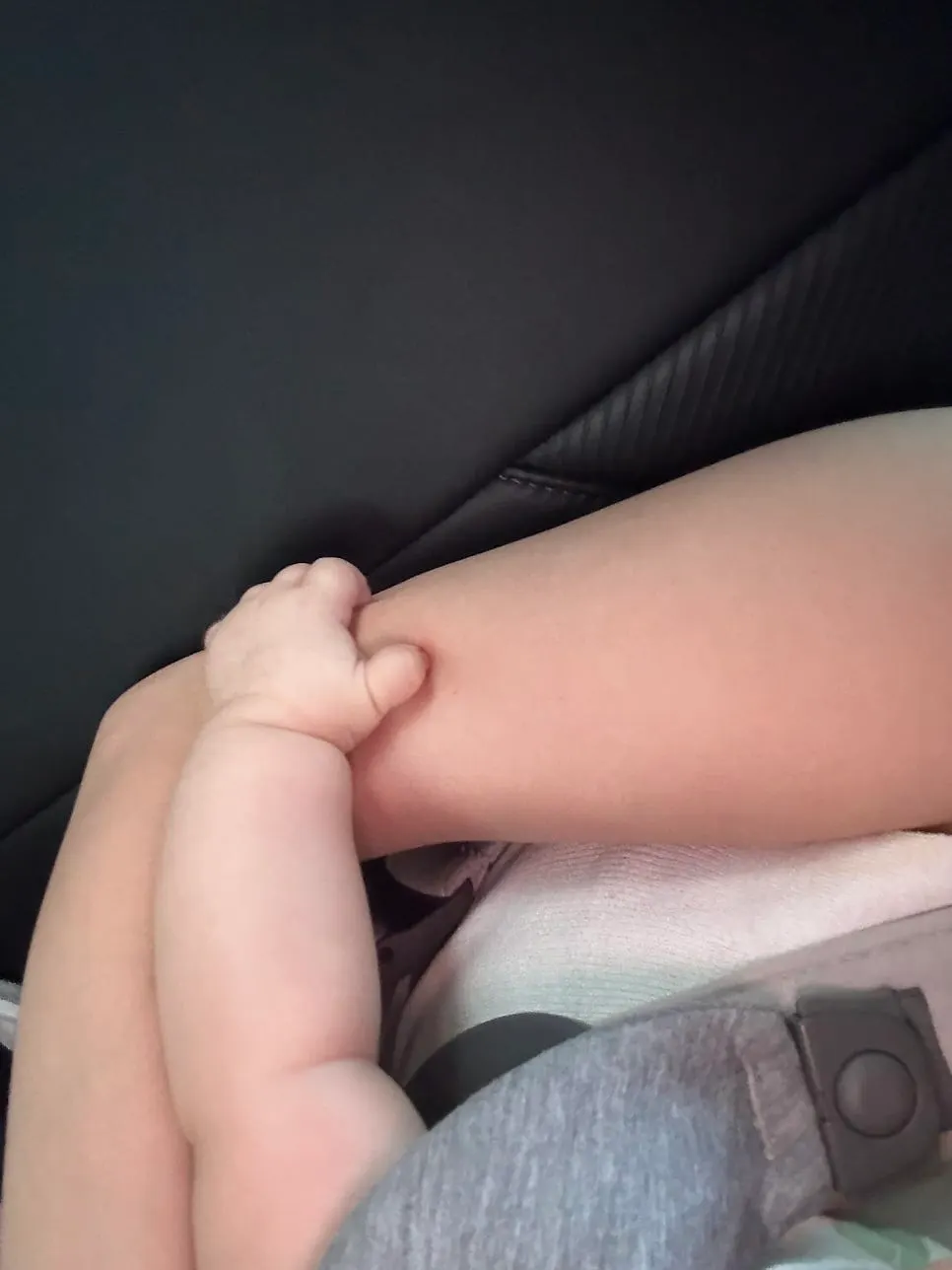 Baby beside the table after the meal was finished