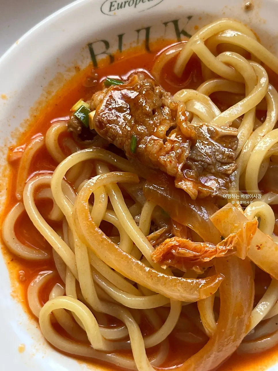 Jjamppong broth topped generously with beef belly