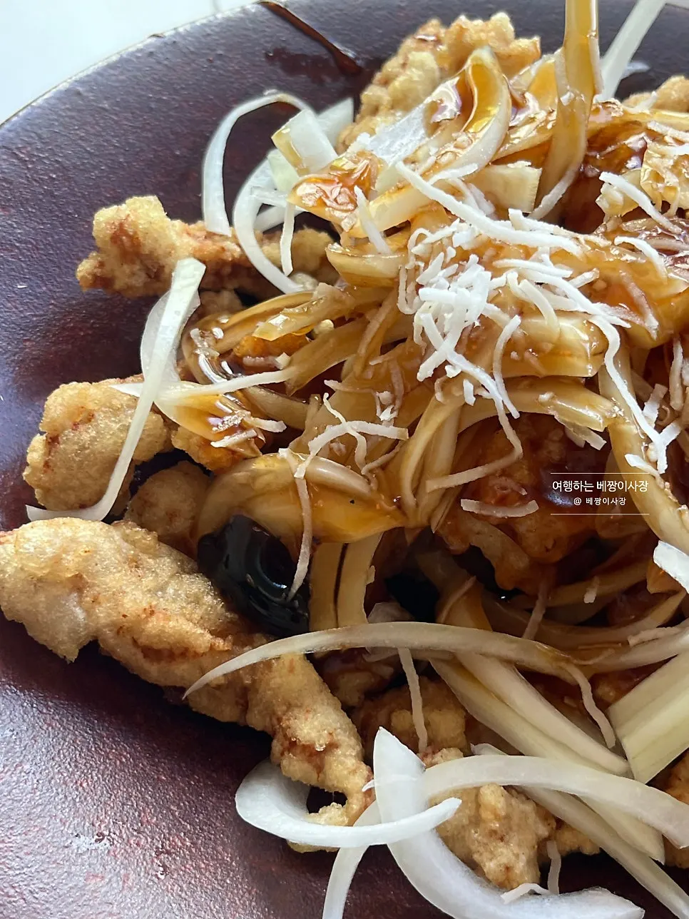 Close-up of the tenderloin tangsuyuk sprinkled with coconut