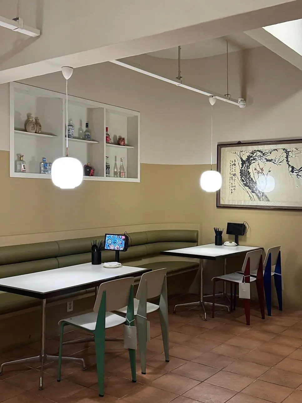Dining hall interior with large China-themed framed pictures