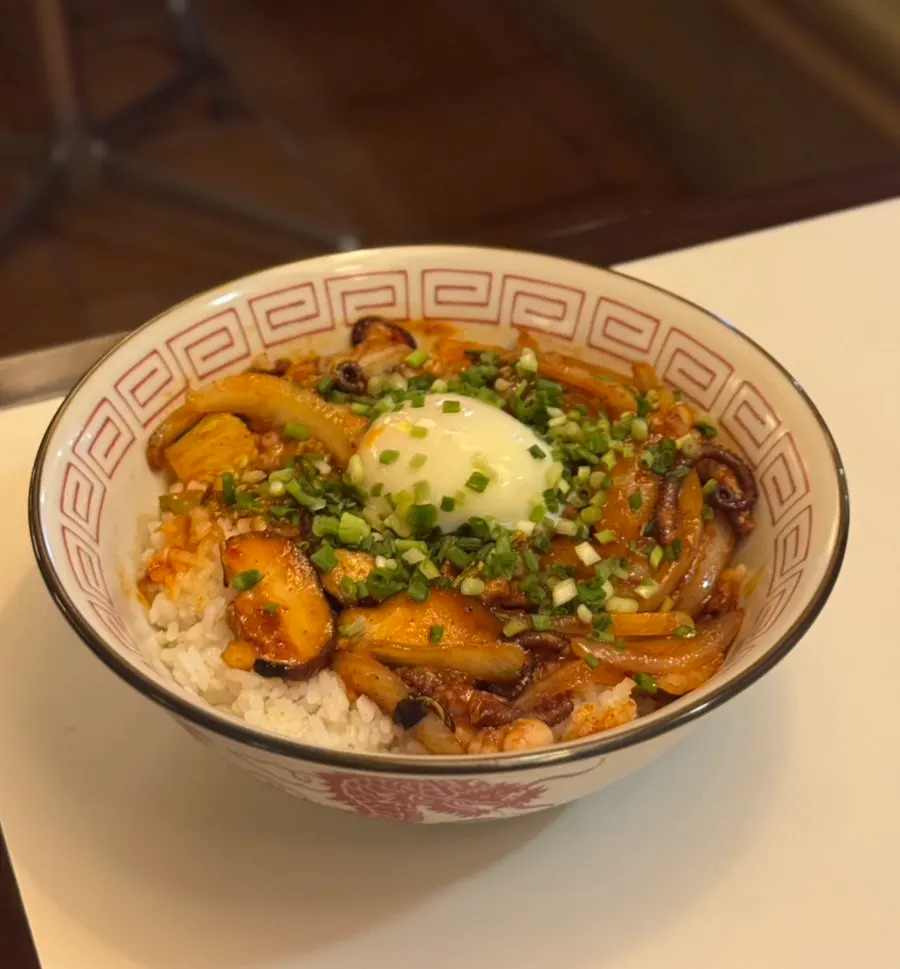 Octopus Chinese-style rice bowl topped with a poached egg