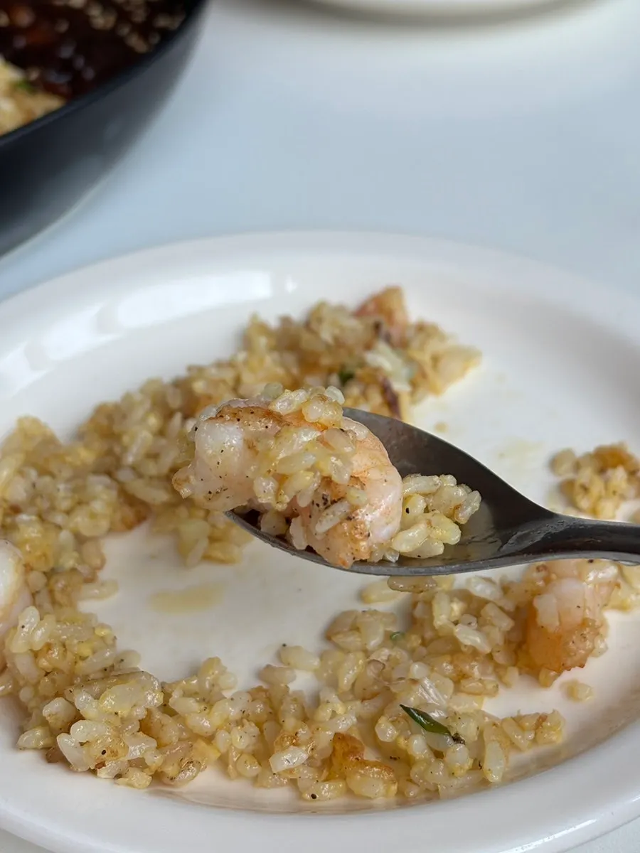 Shrimp fried rice topped with large shrimp