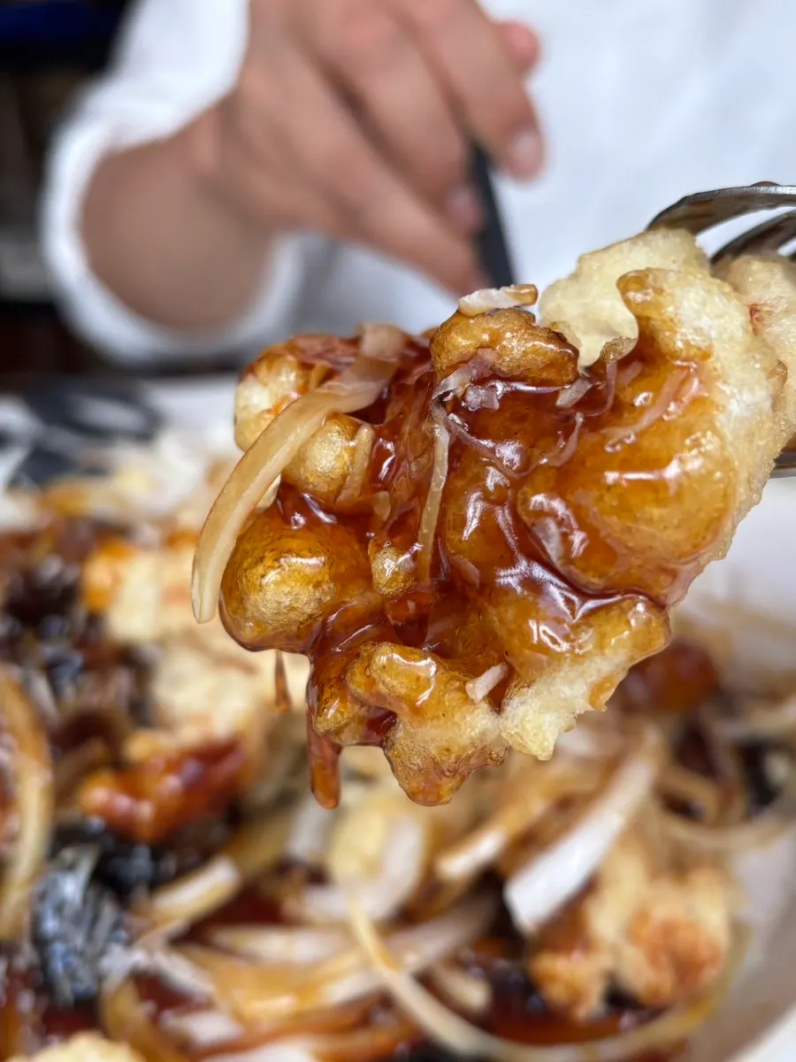 Cross-section of the sweet and sour pork showing juicy meat