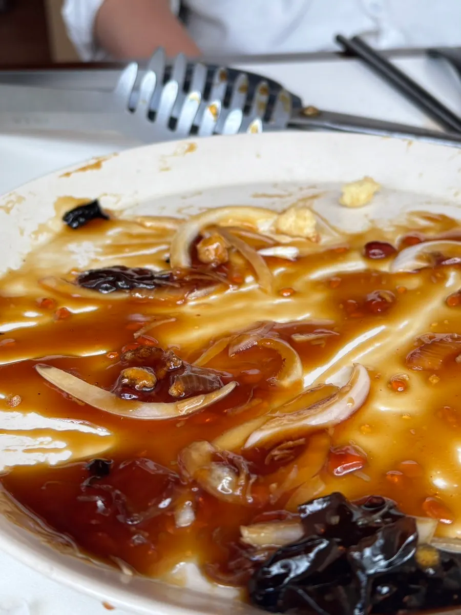 Nearly emptied dishes at the end of the meal