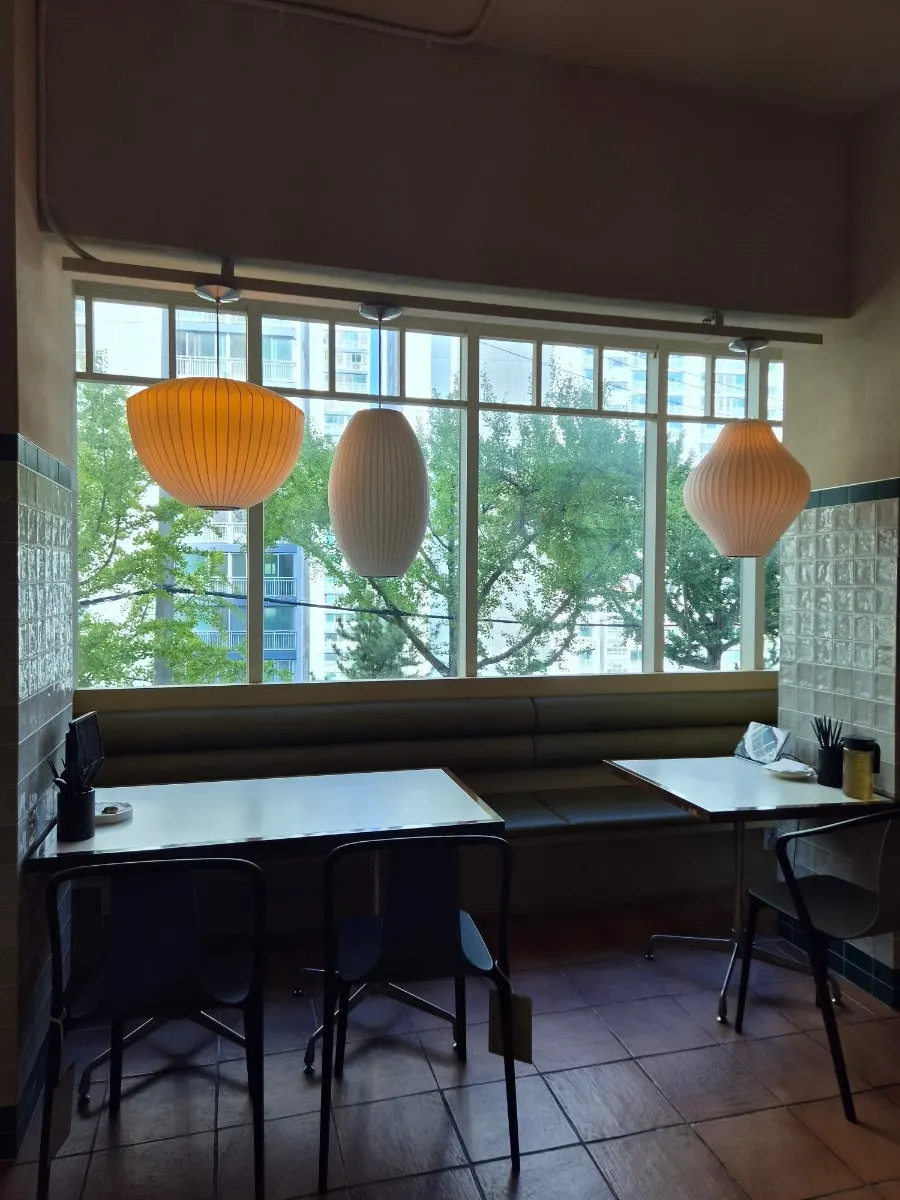 Dining hall with lamps of different shapes