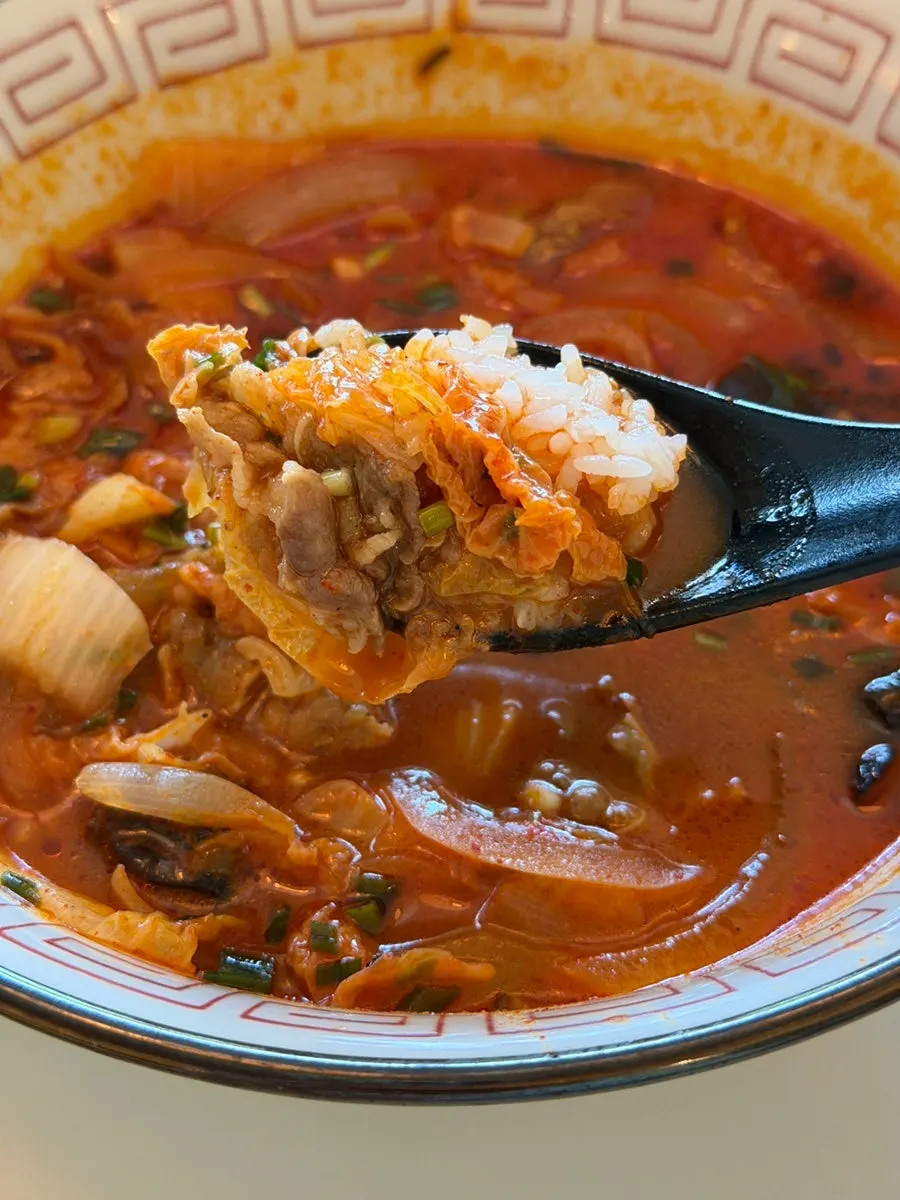 Pouring rice into the fiery jjamppong broth