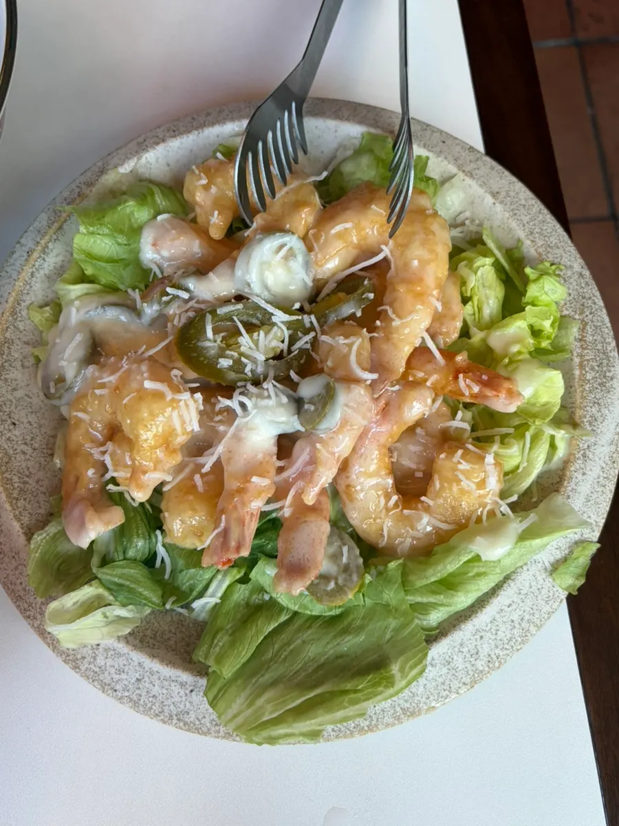 Close-up of cream shrimp sprinkled with coconut powder