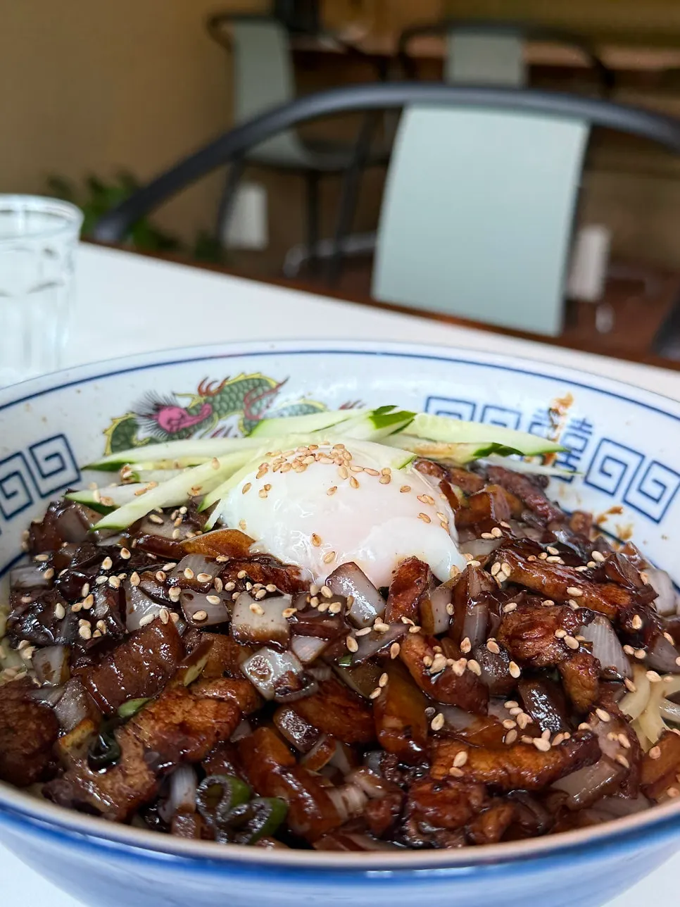 Soft-poached-egg pork belly jjajangmyeon topped with egg and pork belly