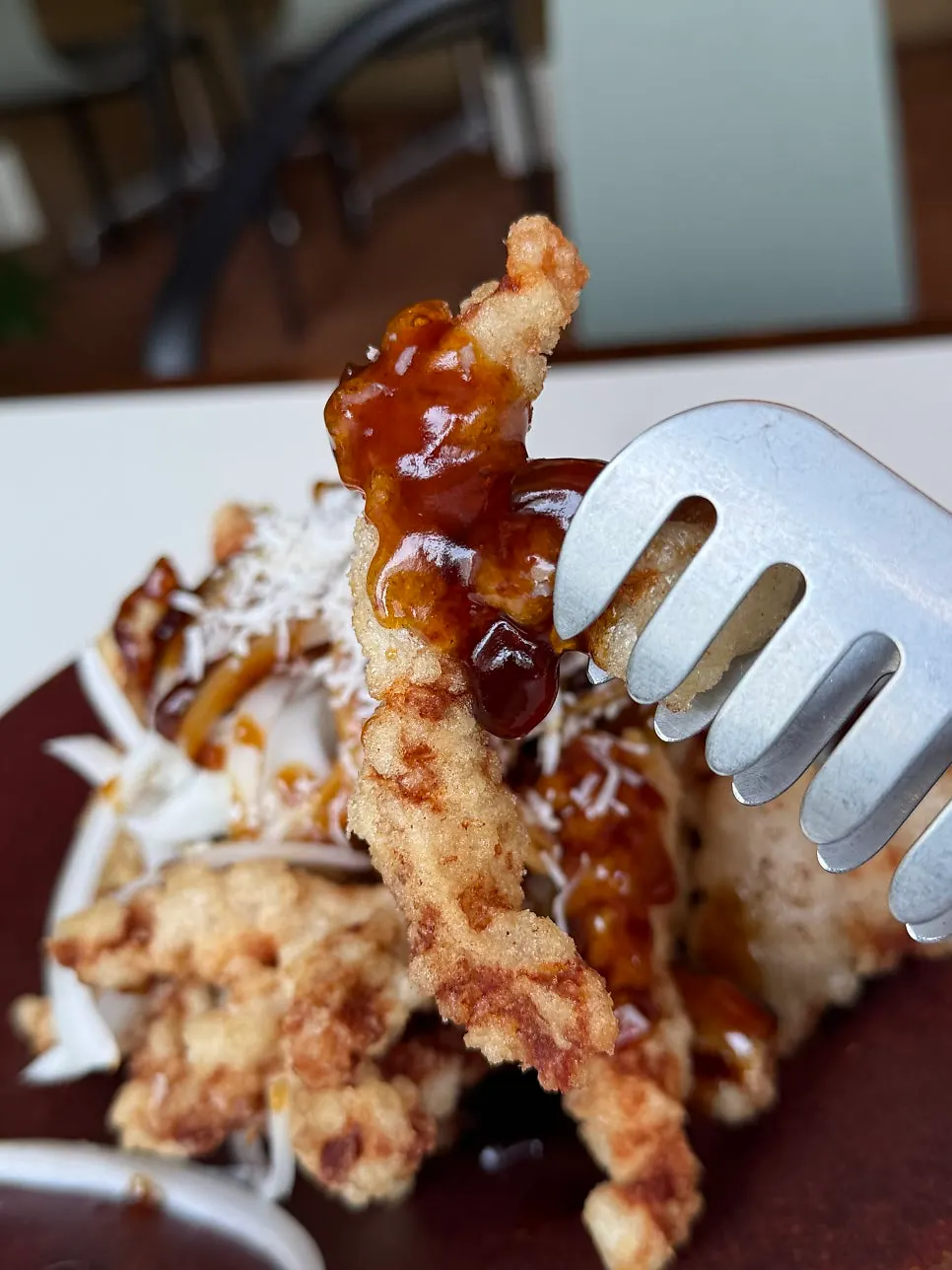 Cross-section of sweet and sour pork with black vinegar sauce