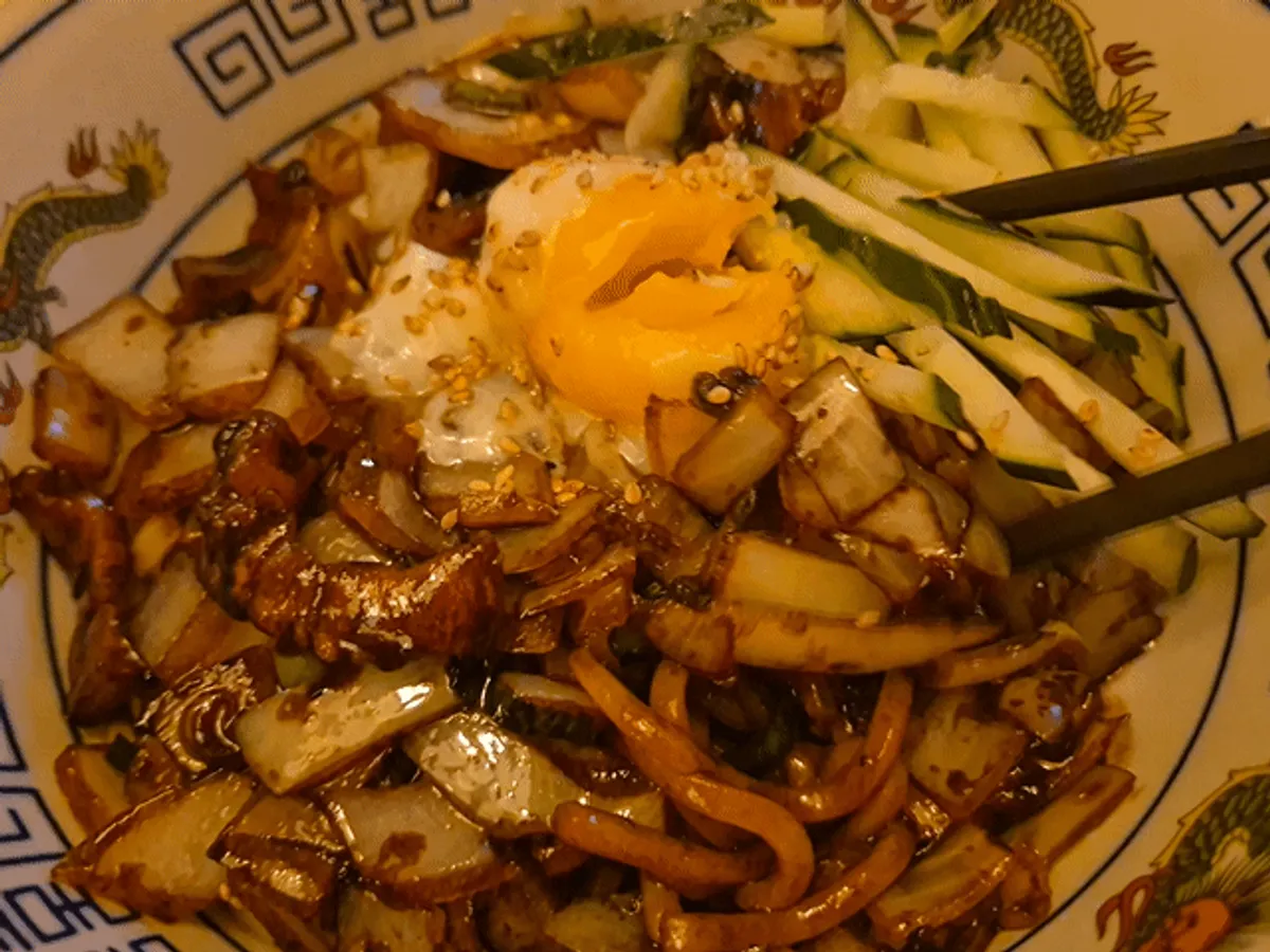 Pork belly ganjjajang topped with a poached egg