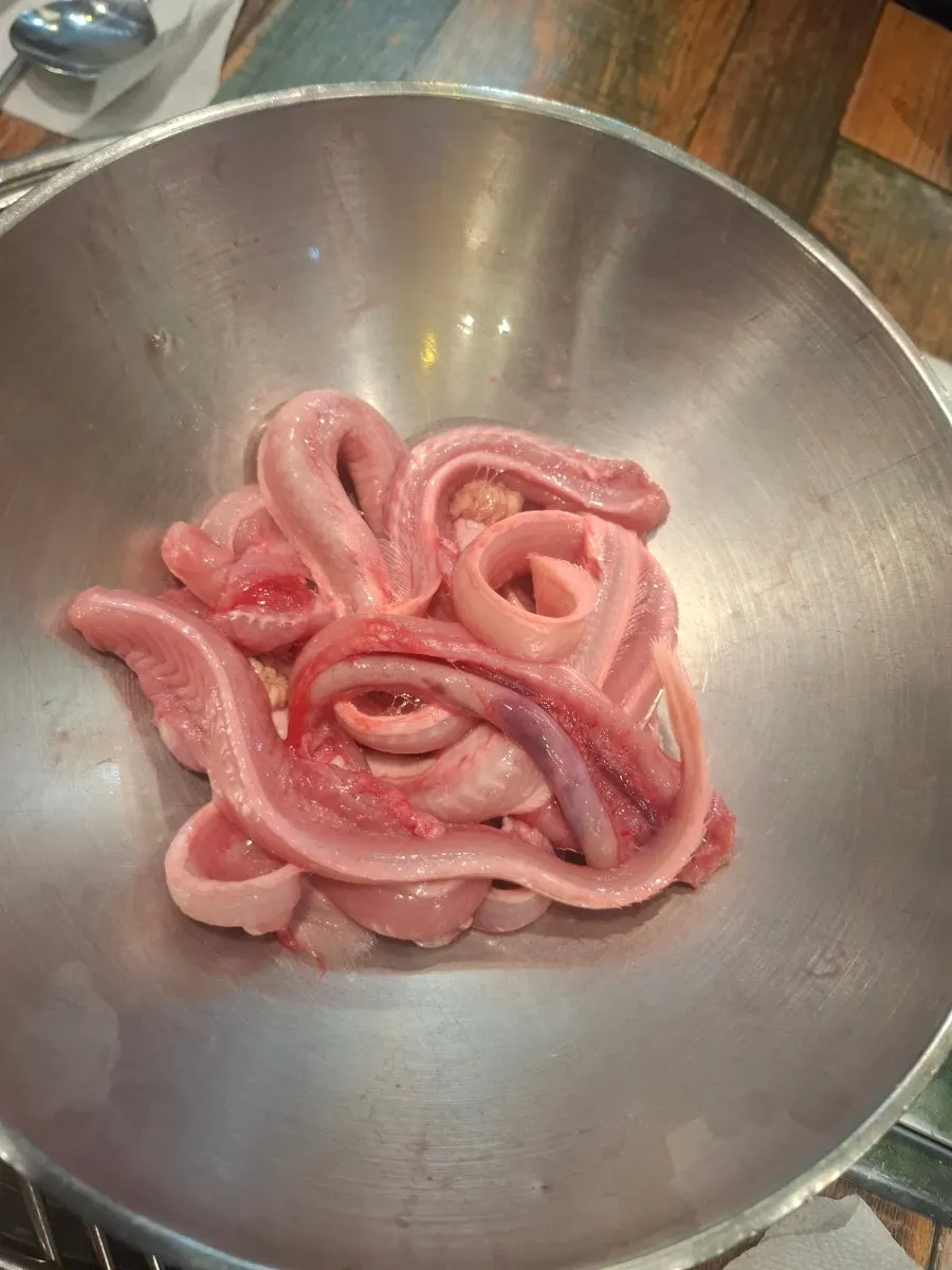 The clam hot pot being prepared at the table