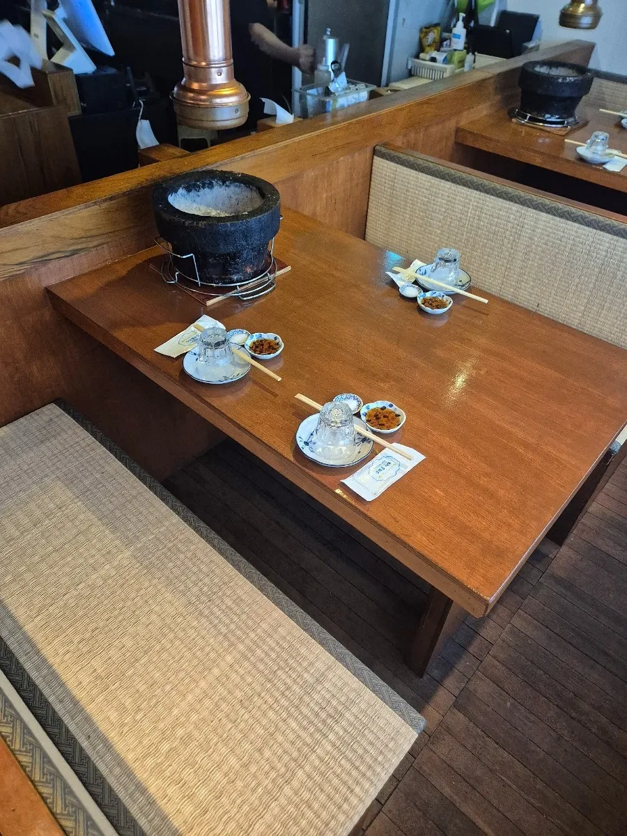 Usiya counter seating and beef preparation area