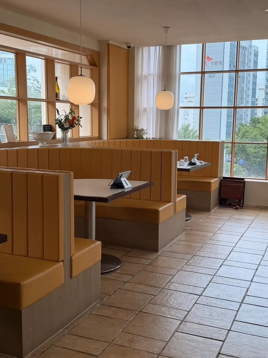 Spacious dining hall with yellow-toned interior
