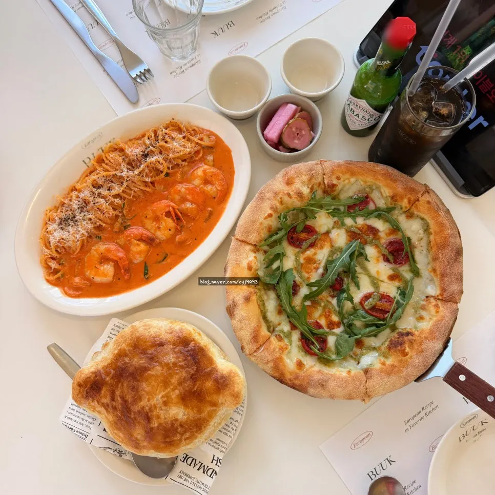 Table with pastry soup and shrimp rosé pasta