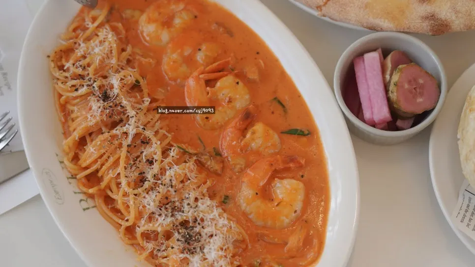 Rosé pasta topped with shrimp and mushrooms
