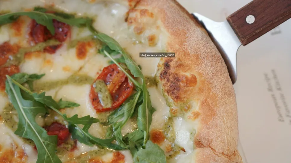 A slice of pizza with stretchy cheese