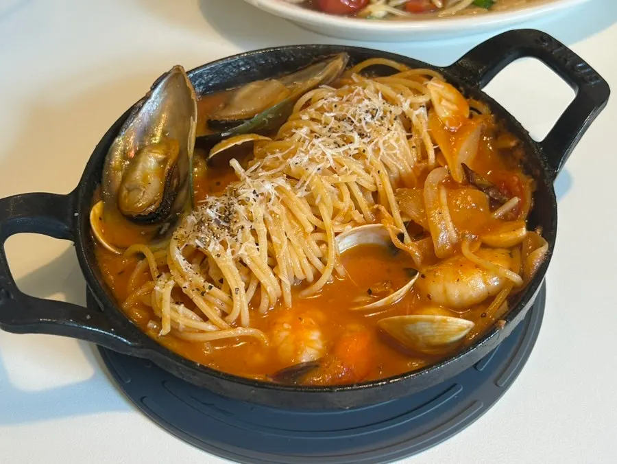 Seafood tomato hot-pot pasta served bubbling hot