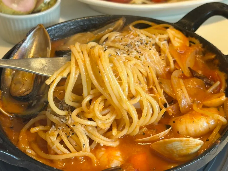Close-up of the seafood tomato hot-pot pasta packed with seafood