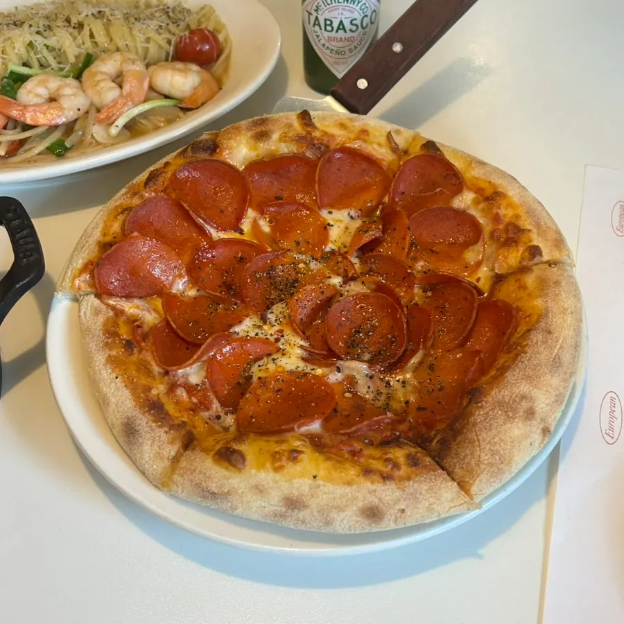 Pepperoni pizza topped with a generous amount of cheese