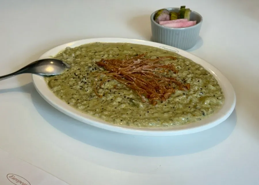 Abalone cream risotto topped with fried enoki mushrooms