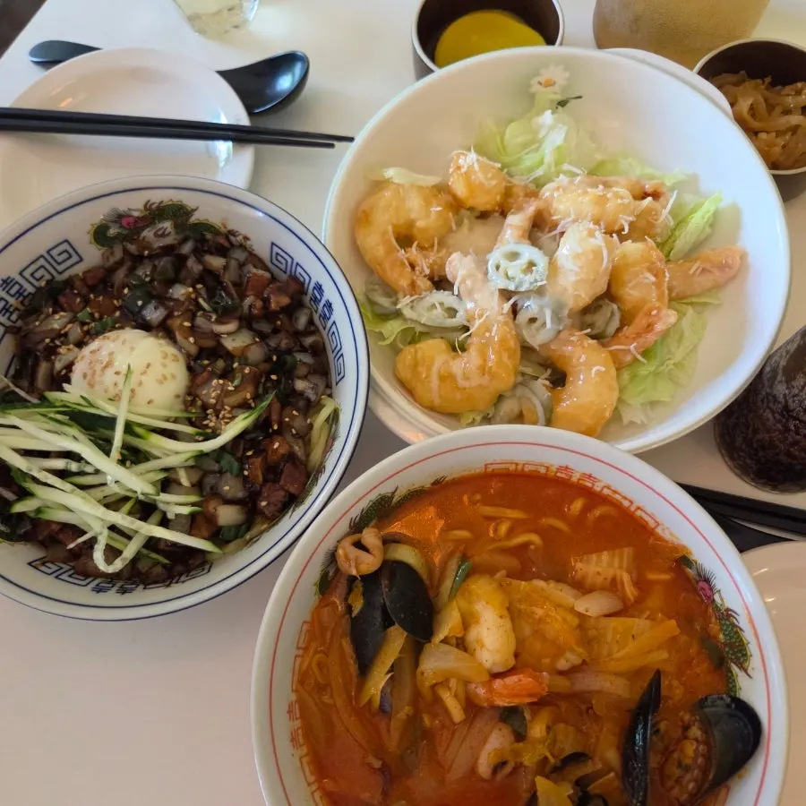 Basic side dishes: pickled radish, jachai, and jasmine tea