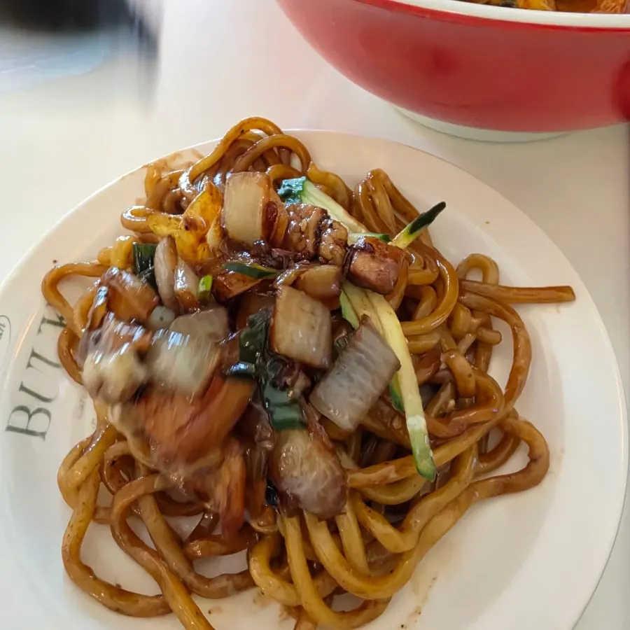 Jjajang sauce loaded with pork belly and vegetables