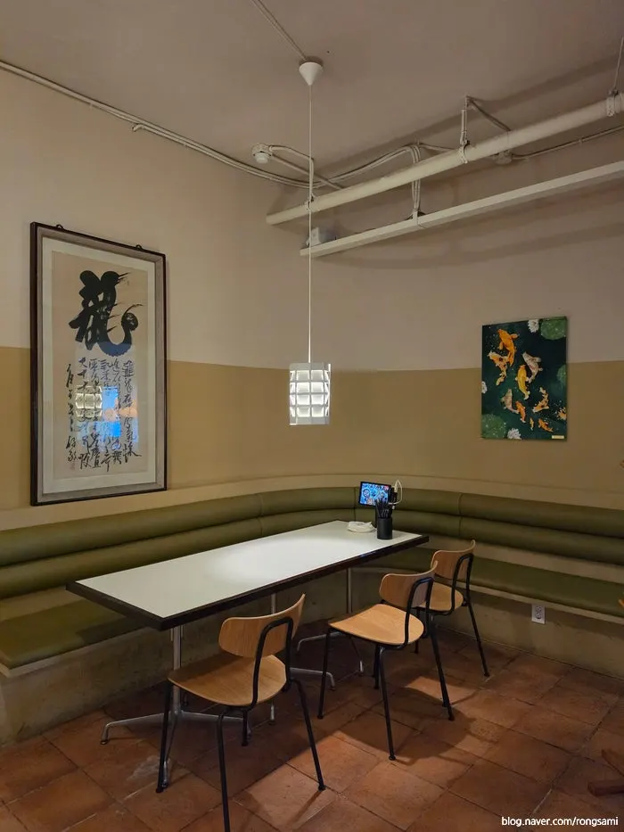 Interior wall hung with Asian-style framed art