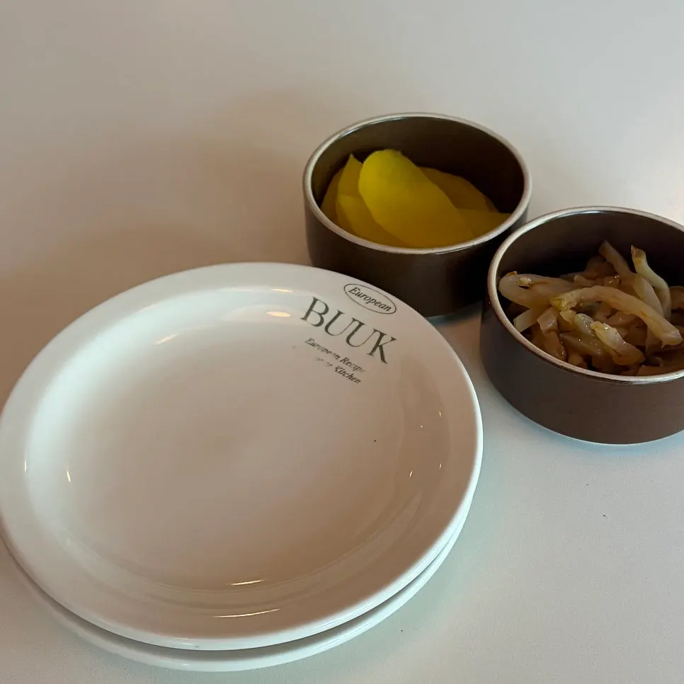 Tableware stamped with the Bueokgan name and side dishes