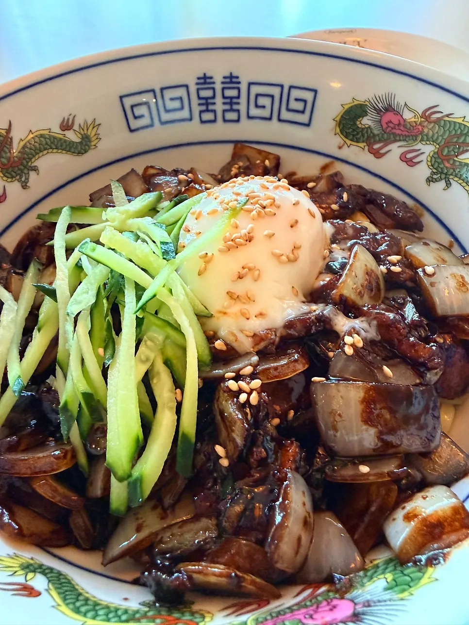 A bowl of poached-egg pork belly jjajangmyeon