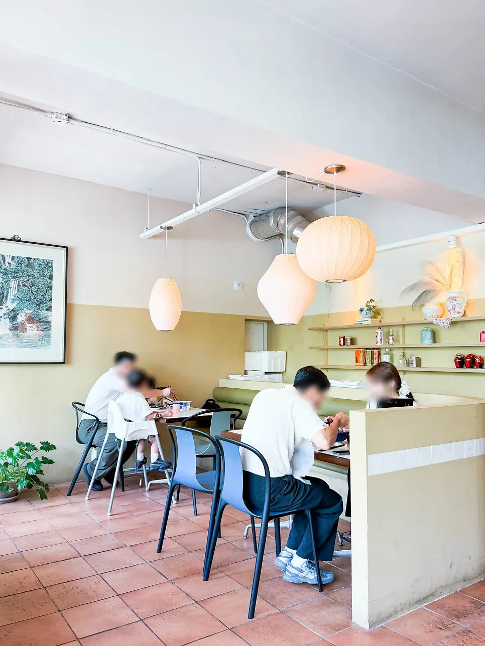 Dining hall seating with green trees visible through the window