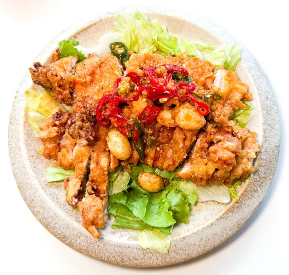 Whole-garlic yuringi served over lettuce