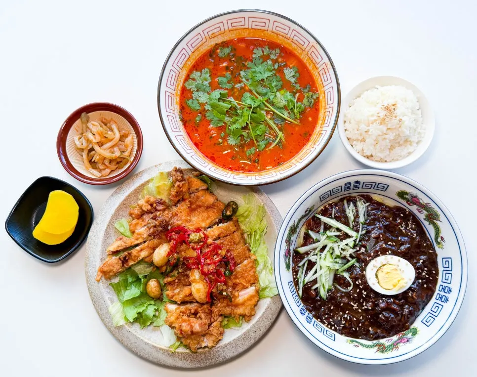A full table spread of Chinese dishes