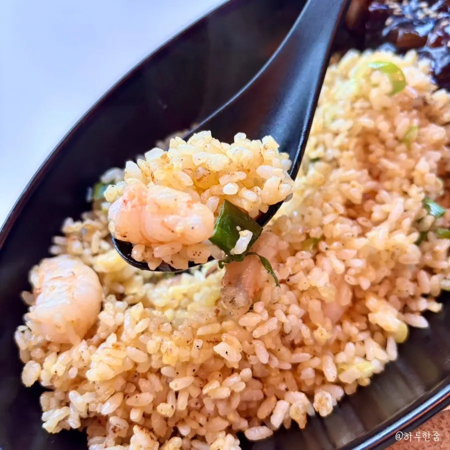 Shrimp fried rice shared with a kid