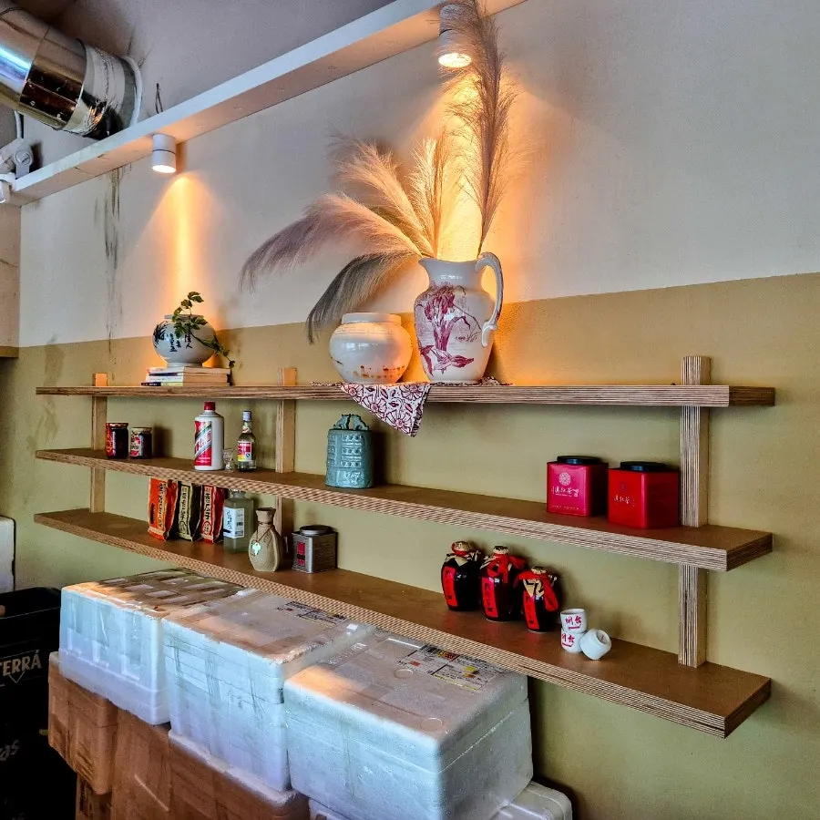 Interior with displayed liquor bottles and upscale furniture