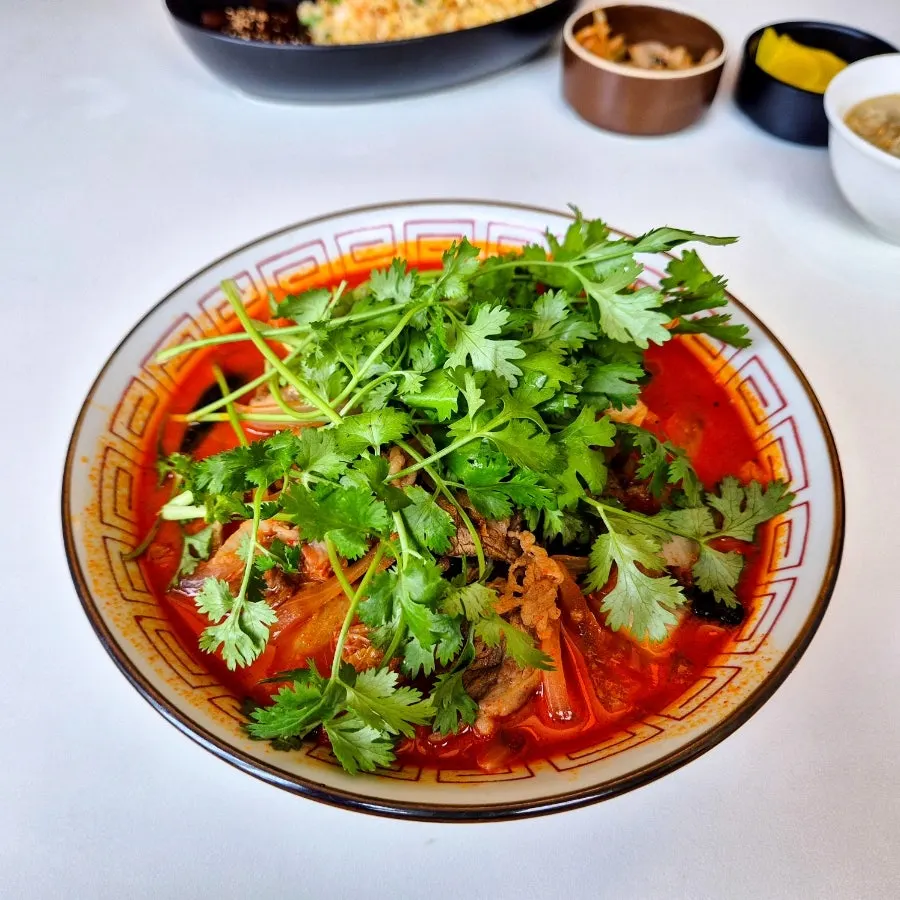 Plate of jjachai and pickled radish side dishes