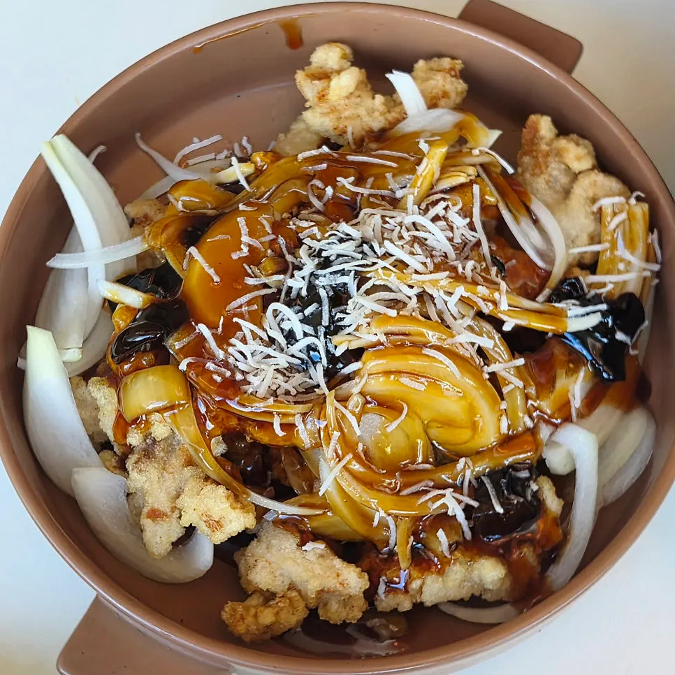 A plate of black vinegar pork loin tangsuyuk