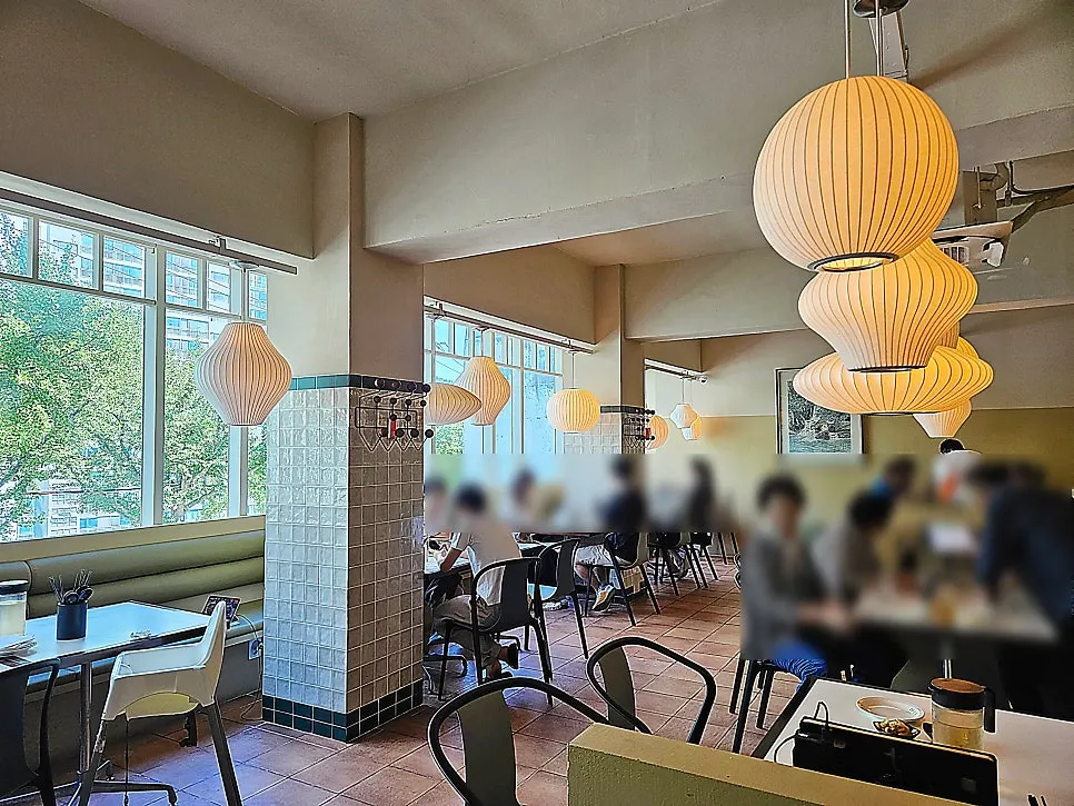Bright, sunlit indoor seating at Bueokgan Chinese
