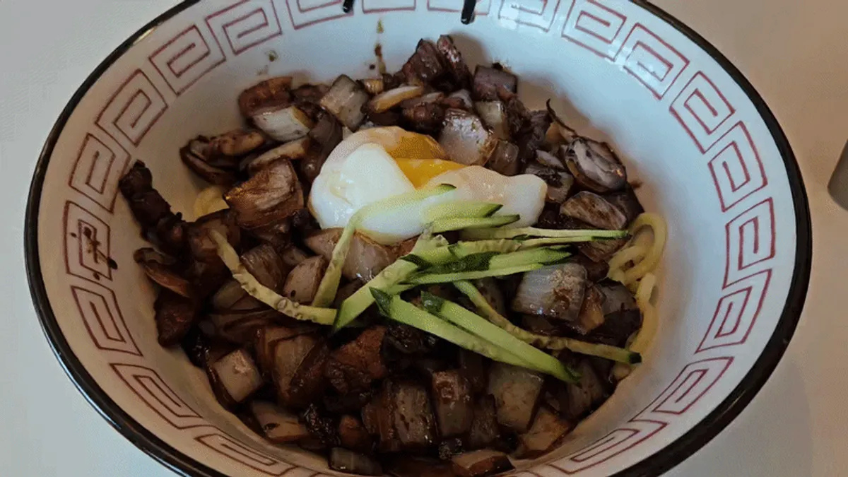 Wok-fried vegetables and meat in the jjajang sauce